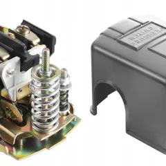 Mechanizm presostatu z elementami sprężynowymi i zaciskami, obok metalowa osłona z napisem "PRESSURE SWITCH".